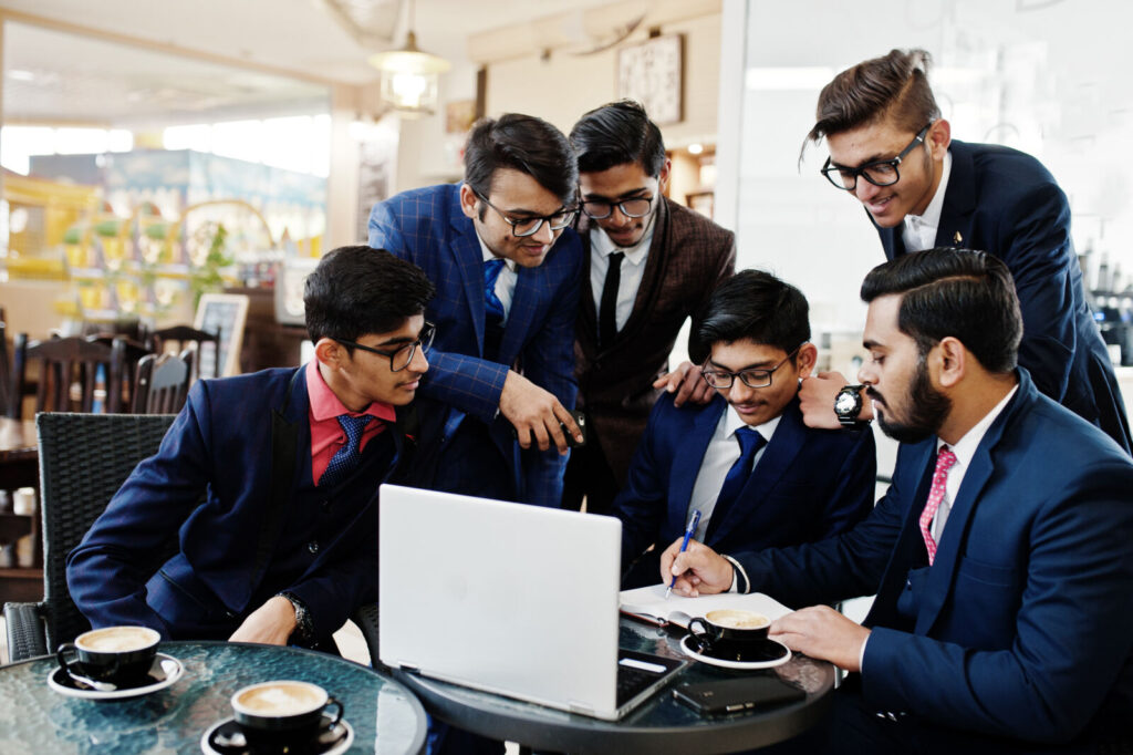 Young Indian business team brainstorming in an office